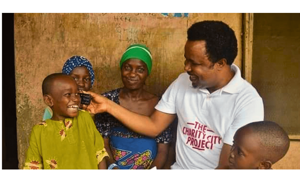 Azemobor Gregory Foundation team making a child smile through humanitarian aid in Nigeria.