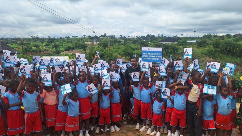 Dr, Azemobor Gregory, with the children of Divine Victory School